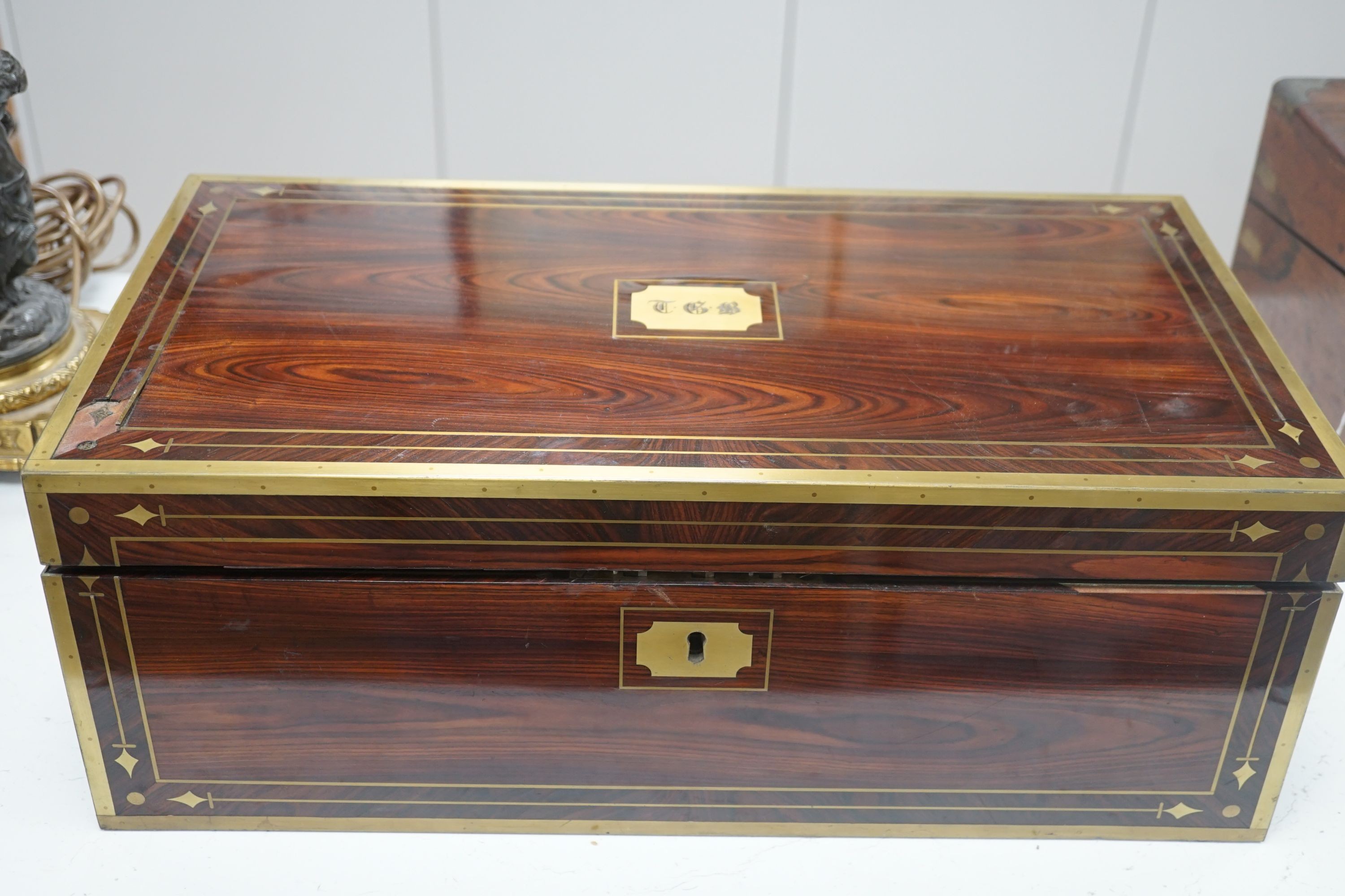 A George IV brass bound kingwood writing slope, 52cm